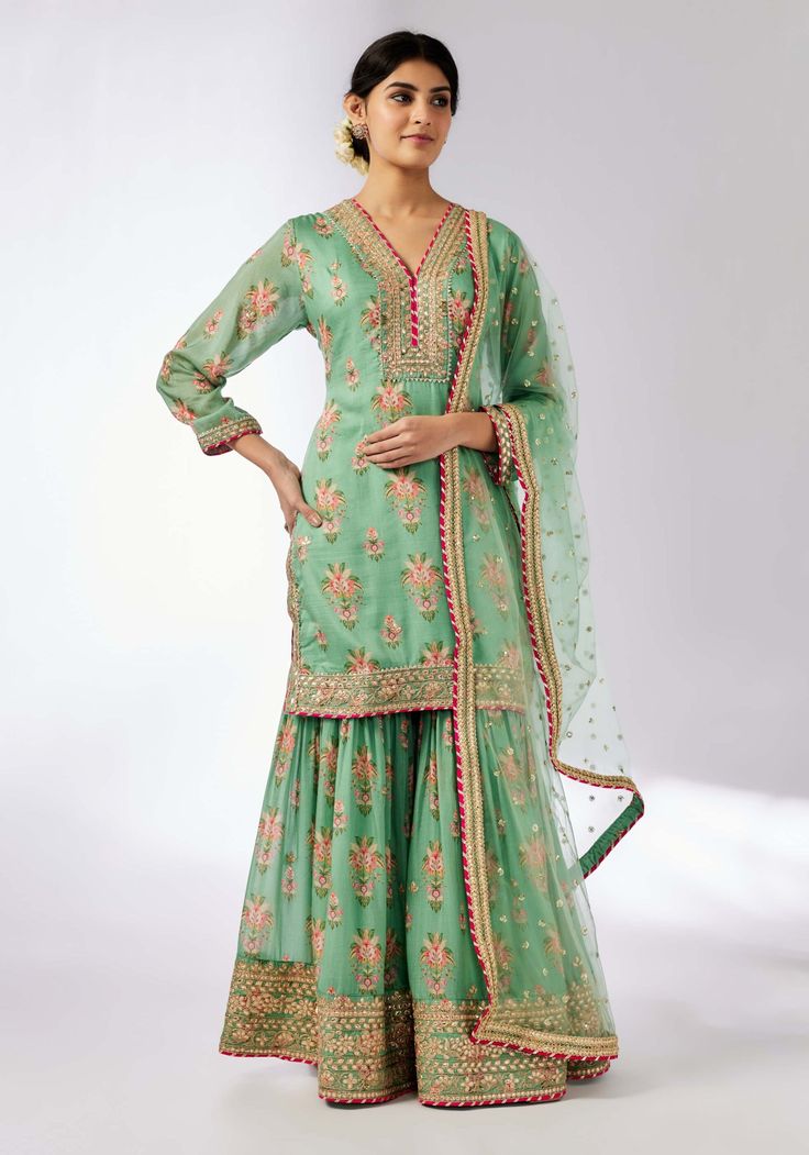 Sadhna Mint Sharara Set by Gopi Vaid, available on Indiaspopup.com Green Palazzo Set With Intricate Embroidery, Pista Green Sharara With Dabka Work For Transitional Season, Embroidered Pista Green Dola Silk Palazzo Set, Anarkali Sharara With Chikankari Embroidery In Dola Silk, Pista Green Intricate Embroidery Chanderi Palazzo Set, Pista Green Embroidered Chanderi Sharara, Transitional Pista Green Palazzo Set With Dabka Work, Chinon Sharara With Chikankari Embroidery For Navratri, Navratri Chikankari Embroidery Sharara In Chinon