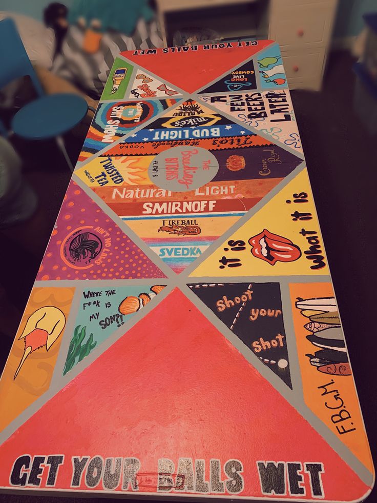 an upside down view of a colorful table top with various stickers on it and the words get your bus wet