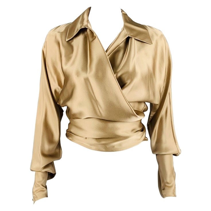 Luxury Long Sleeve Beige Top, Luxury Beige Long Sleeve Tops, Chic Satin Wrap Blouse, Elegant Gold Blouse For Workwear, Elegant Gold Blouse For Work, Gold V-neck Blouse For Work, Luxury Long Sleeve Blouse For Evening, Luxury Long Sleeve Evening Blouse, Silk Evening Wrap Blouse