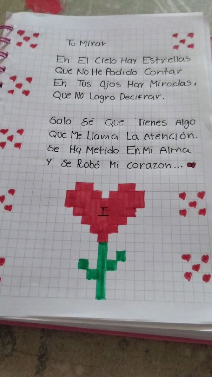 a cross stitch poem written in spanish on a notebook with red hearts and green stems