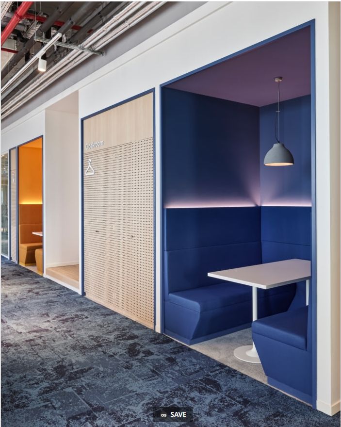 an empty room with blue and white booths