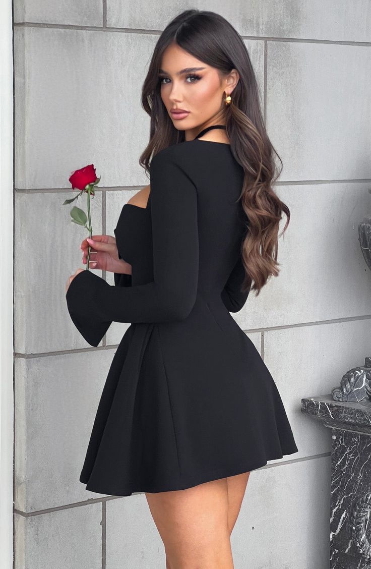 There's a feel of romance about Megan, a mini dress made for those special occasions. Cut from our premium stretch crepe, this design has a cinched waist and panels at the hips to create a full, voluminious skirt. The style is finished with a dainty sweetheart neckline, velvet bow and long fitted sleeves. Wear with slip on mule heels in cherry red. 



Colour: Black.

Premium stretch crepe fabric.

Fully lined.

Long sleeves.

Sweetheart neckline with gathered detail.

Velvet bow detail to bust. Cherry Red Colour, Homecoming Dresses Corset, Bday Photoshoot, Long Sleeve Homecoming Dresses, Midi Dress Wedding Guest, Voluminous Skirt, Split Long Dress, Mule Heels, Homecoming Dresses Long