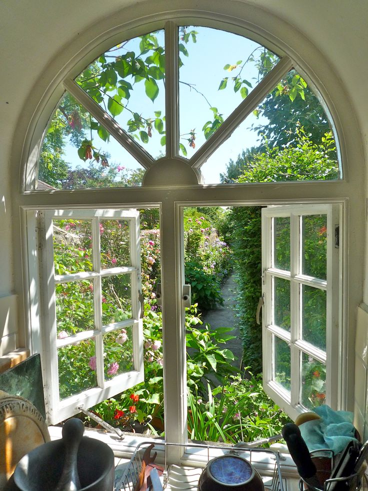 an open window shows a garden outside