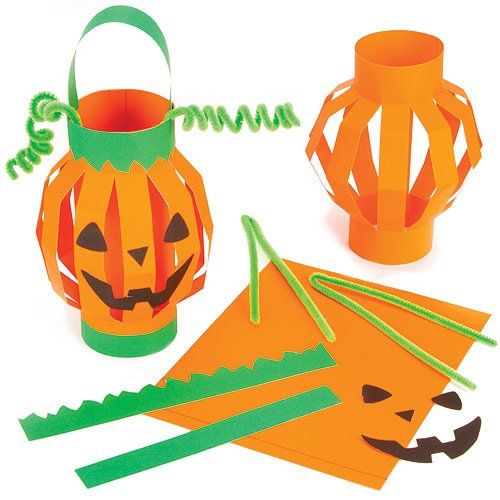 a paper pumpkin lantern and other crafting supplies on a white background with the words halloween written in green