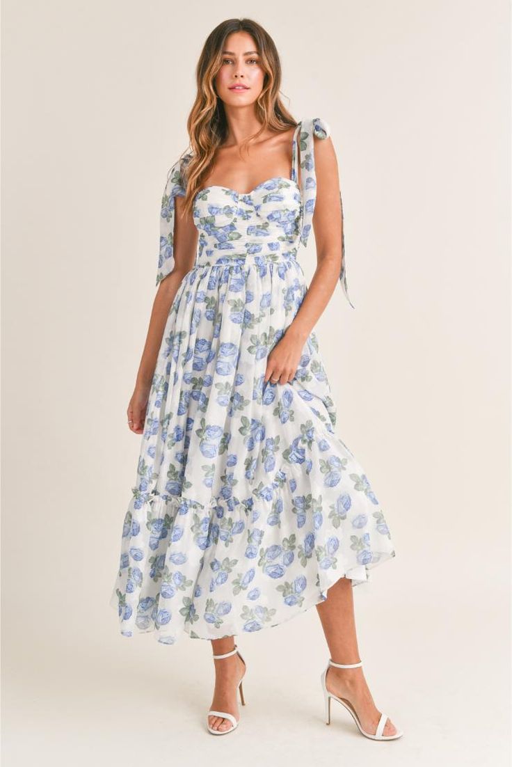 Channel sunny-day vibes in this romantic midi sundress topped by flirty shoulder ties and styled with a sultry ruched bust. • Chiffon floral print • Ruched bust • Light bra-cup • Tiered midi dress• Self tie shoulder straps• Back smocked • Back Zipper detail Cindy Dress, Party Bottoms, Flower Maxi Dress, Floral Bustier, Blue Florals, Midi Sundress, Bra Cup, Chiffon Floral, Tiered Midi Dress