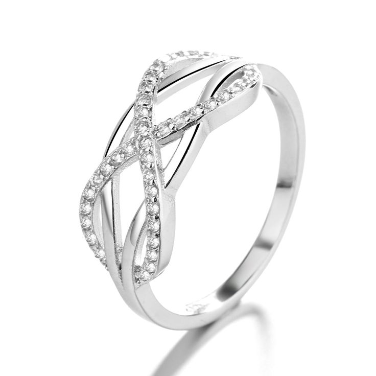 The Sterling Silver Intertwined Ring with Swarovski® Crystals is a stunning and unique piece of jewelry that combines the beauty of sterling silver with the sparkle of Swarovski crystals. The ring features two intertwined bands that are made of high-quality sterling silver, which gives the ring a sleek and polished look that is both elegant and sophisticated. The intertwining bands of the ring are embellished with crystals from Swarovski, which are finely crafted and polished to a high shine. Th Intertwined Ring, Crystal Colors, Elegant Ring, Sterling Silver Bands, Center Stage, Polished Look, Eternity Ring, Silver Band, Women Rings