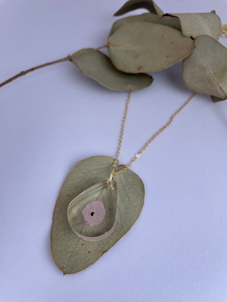 The necklace is a heartfelt reminder of strength and resilience. It features a delicate pendant with a symbolic poppyseed, representing the precious life that was lost. It's a beautiful way to honor the memory of your little angel. 💕 * How To Order * - Select chain material silver/gold - Click 'add to cart' - Checkout and complete order - Please let me know if you want me to use a specific flower/petal/seed. - From this moment I will need 5 to 10 business days to make the necklace for you. Perf Spiritual Everyday Jewelry With Birth Flower, Everyday Spiritual Jewelry With Birth Flower, Sterling Silver Teardrop Birthstone Necklace Gift, Everyday Birth Flower Pendant Jewelry, Hypoallergenic Jewelry For Mother's Day Keepsake, Delicate Heart-shaped Keepsake Necklaces, Delicate Heart Necklace For Keepsake, Delicate Heart-shaped Keepsake Necklace, Personalized Flower Pendant Necklace For Keepsake