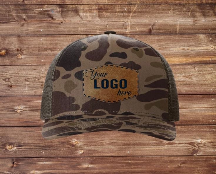 Hat Information:  * Richardson 112PFP Printed Camo Five Panel Trucker (We do not substitute hat styles) * Mid Profile * 5 Panel * Precurved Visor * Cotton/Polyester Panels Sizing:  * Adjustable Snapback  * OSFM (7 -7 3/4) Patch Information:  * Vegan leather laser engraved patches - patches engrave to the color shown in listing photos.  * We will use our standard patch sizing unless otherwise requested.  * Our patches are applied with heat activated adhesive. We do not sew on any of our patches. Brown Military Hat, One Size Fits Most, Military Style Flat Brim Trucker Hat For Outdoor, Military Style Brown Hat With Curved Brim, Brown Military Hat With Curved Brim, Brown Military Trucker Hat, Brown Military Style Trucker Hat, Military Style Brown Baseball Cap With Flat Bill, Military Style Brown Baseball Cap, Brown Military Hat For Outdoor