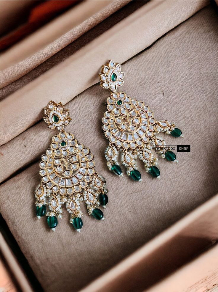 22k Gold plated Tayani chandbali Beads Stone Earrings.These 22k Gold plated Tayani chandbali Beads Stone Earrings exude elegance and luxury. The intricate design and high-quality materials make them a timeless accessory that will elevate any outfit. Experience the beauty and durability of these earrings, perfect for any occasion. Eid Kundan Chandbalis With Intricate Design, Eid Chandbalis With Intricate Kundan Design, Eid Chandbalis With Intricate Design In Kundan, Temple Jewelry Chandbalis With Stone Work For Eid, Stone Work Chandbali Chandelier Earrings For Celebration, Temple Jewelry Chandbalis With Cutdana, Bollywood Style Kundan Hoop Earrings With Intricate Design, Festive Tilla Chandbalis Drop Earrings, Festive Chandbalis For Diwali