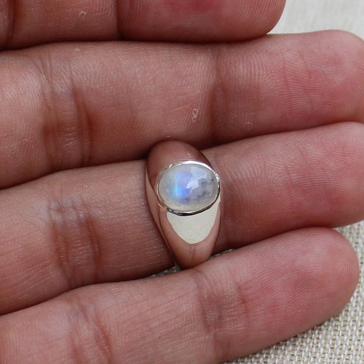 Gemstone - Natural Rainbow Moonstone Gemstone Size - 7x9 mm oval Metal - Sterling Silver Natural AAA rainbow moonstone set with a sterling silver handmade ring  Each Ring made with Precision and love, these rings are perfect for everyday use and a perfect accessory to wear at work.  Rings can be customized on request and gemstone can be switched to any other as per requirement.  Other beautiful designs uploaded with fabulous gemstones. kindly visit my store to view the complete collection.  Feel Untreated Round Opal Ring As A Gift, Untreated Round Opal Ring For Gift, Untreated Round Opal Ring As Gift, Oval Moonstone Ring For Gift, White Oval Moonstone Ring Gift, Oval Cabochon Moonstone Ring For Anniversary, Oval Moonstone Ring Gift, Handmade Oval Moonstone Ring For Anniversary, Oval Moonstone Promise Ring With Polished Finish