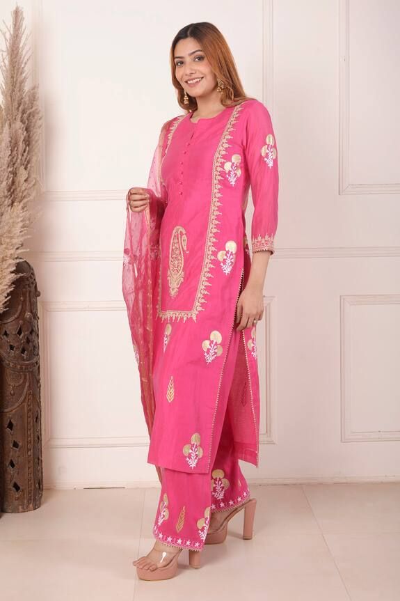 Rani pink kurta featuring all over block foil printed floral patterns highlighted with dori embroidered paisley and floral motifs. Comes with palazzo and dupatta.
Components: 3
Pattern: Block Print, Embroidered
Type Of Work: Floral, Dori
Neckline: Notched
Sleeve Type: Three quarters
Fabric: Kurta: Chanderi, Palazzo: Cotton Certain, Dupatta: Organza 
Color: Pink
Other Details: 
Length:
Kurta:  47 Inches
Palazzo: 38 Inches
Dupatta: 2.5 Mtr 
Occasion: Sangeet,Mehendi and Haldi - Aza Fashions Pink Traditional Wear With Resham Embroidery For Navratri, Pink Kurta With Gota Work And Traditional Drape, Pink Chanderi Set With Gota Work, Festive Pink Kurta With Zari Work, Pink Cotton Silk Sharara With Dupatta, Festive Pink Chanderi Sets, Pink Kurta With Zari Work In Traditional Drape, Traditional Pink Designer Kurta, Pink Cotton Silk Sharara With Resham Embroidery