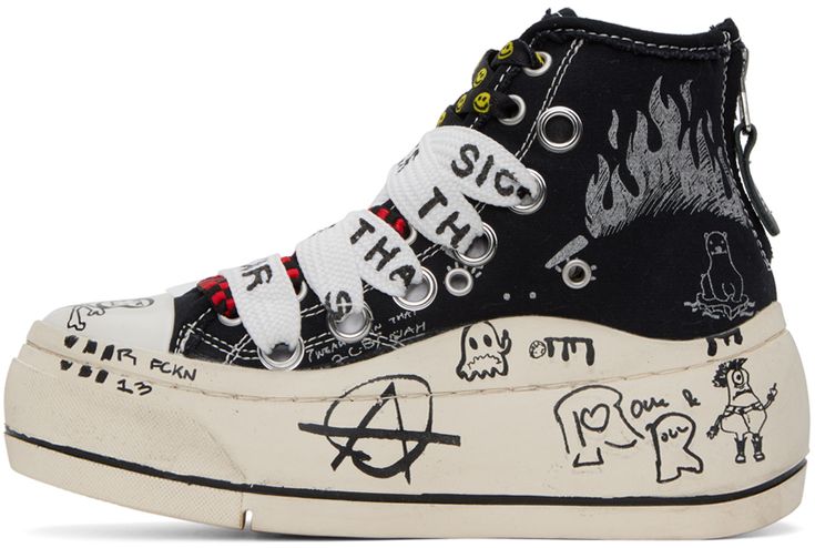 High-top canvas sneakers in black and white. Logo and graphics printed throughout. · Rubber cap toe · Double lace-up closure · Eyelets vents at inner side · Rubberized logo graphic patch at outer side · Zip fastening at heel · Hand-stitched rubber platform midsole · Treaded rubber outsole · Platform: H1.5 in Supplier color: Black graffiti checker High-top Skate Shoes With Embroidered Logo For Streetwear, Canvas High-top Sneakers With Logo Print For Streetwear, Canvas High-top Lace-up Sneakers With Logo Print, Lace-up High-top Canvas Sneakers With Logo, Sporty Lace-up Canvas Shoes With Graphic Print, Black High-top Custom Sneakers With Embroidered Logo, Canvas High-top Sneakers With Embroidered Logo For Streetwear, Black Canvas Custom Sneakers For Streetwear, Streetwear High-top Canvas Sneakers With Embroidered Logo