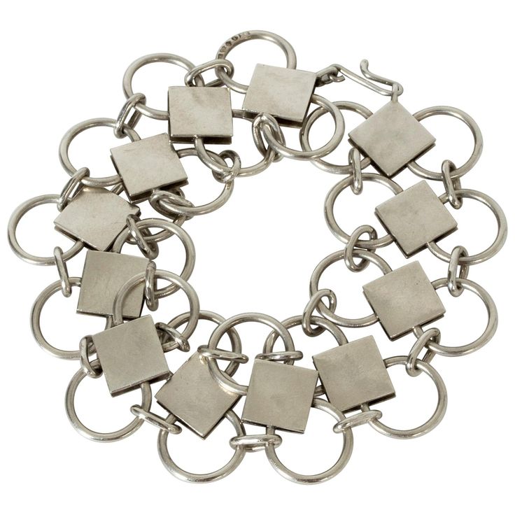 Striking silver bracelet by Sigurd Persson, with links in a clean, geometric design. Elegant play between the open circles and brushed square forms. Long length, easily shortened. Modern Sterling Silver Bracelet With Rectangular Links, Contemporary Sterling Silver Bracelet, Modern Sterling Silver Jubilee Bracelet With Rectangular Links, Modern Silver Square Jewelry, Modern Square Jewelry With Box Chain, Modern Silver Jewelry With Rectangular Links, Modern Silver Rectangular Chain Bracelet, Modern Nickel-free Sterling Silver Bracelet, Modern Rectangular Metal Bracelets