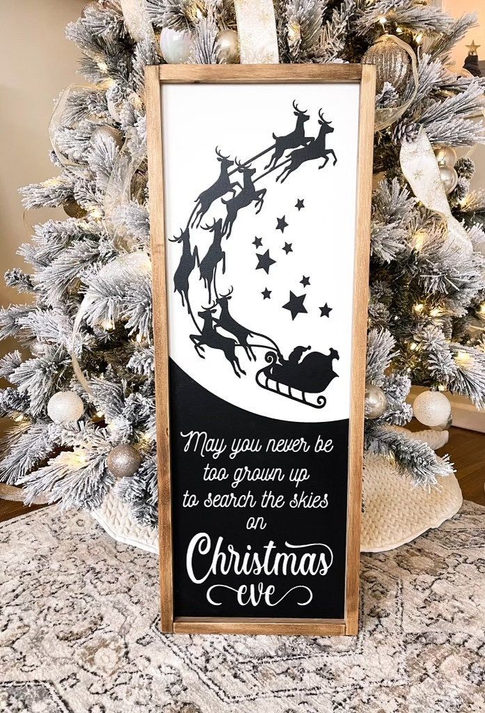 a wooden sign that reads may you never be too old to search the skies on christmas eve