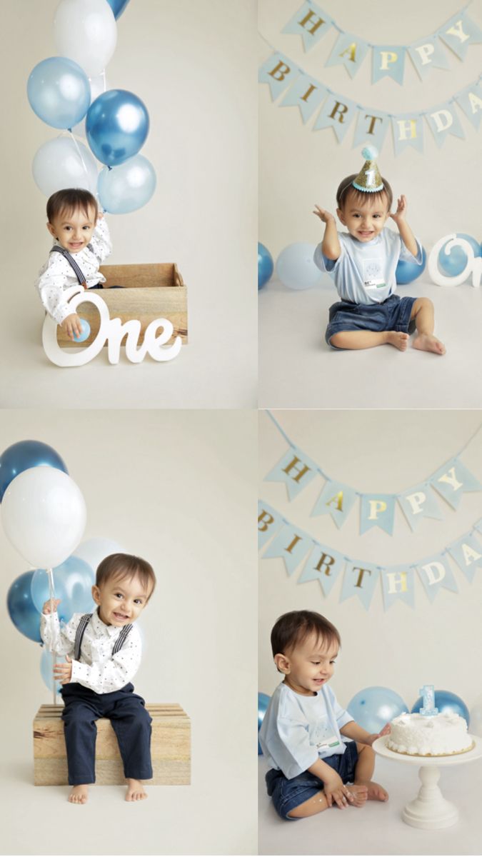 a little boy sitting on top of a wooden box with balloons in front of him