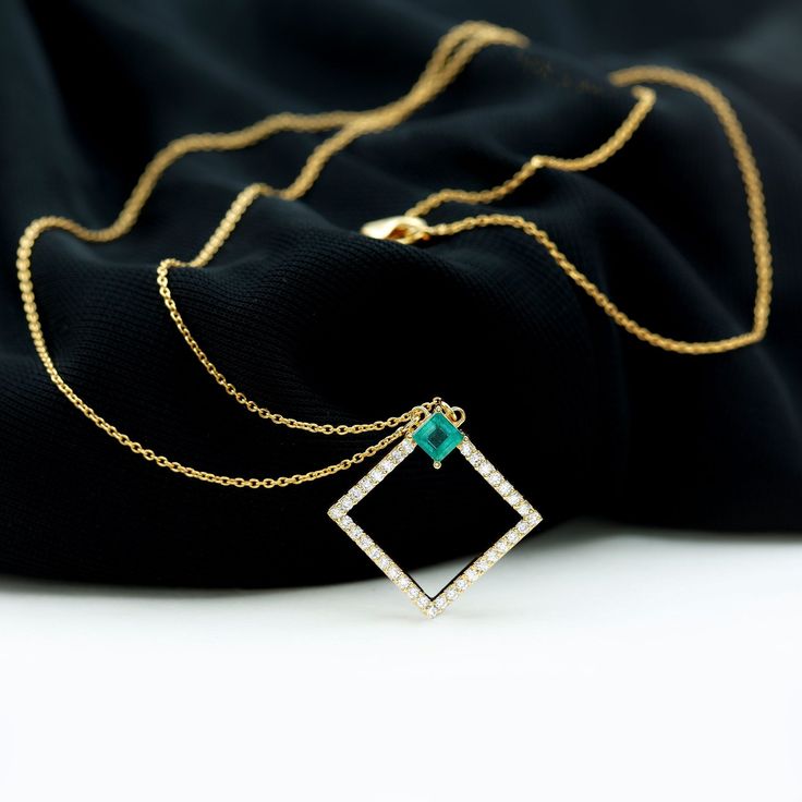 Product Details Enhance your jewelry collection with this exquisite Antique Diamond Emerald Pendant, featuring a stunning Solitaire Princess Cut Emerald as the centerpiece of the Open Square Design. Adorned with Round Brilliant Cut Diamond, this unique Womens Promise Pendant is crafted from Solid Gold, making it a luxurious addition to any outfit. Product Information SKU SHP-PENDANT032013897 Length 22 mm Width 21.6 mm Height 3 mm Weight 2.67 gm (Approximate) EMERALD INFORMATION No.of Stones 1 Pi Luxury Jewelry With Single Cut Diamonds For May Birthstone, Gold Emerald Necklace With Single Cut Diamonds For Anniversary, Gold Jewelry With Single Cut Diamonds For May Birthstone, Luxury Gold Emerald Jewelry With Single Cut Diamonds, Gold Emerald Jewelry With Single Cut Diamonds, Wedding Jewelry With Single Cut May Birthstone Diamonds, May Birthstone Jewelry With Single Cut Diamonds For Wedding, May Birthstone Jewelry With Single Cut Diamonds, Gold Emerald Necklace With Diamond Accents For Anniversary