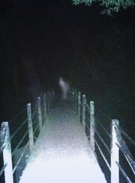 there is a light at the end of this path that looks like it's going down