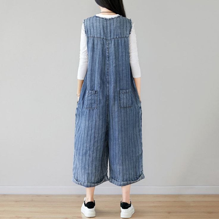 Denim Sleeveless Cropped Jumpsuit in Dark Blue Stripes for Women This Denim Sleeveless Cropped Jumpsuit in Dark Blue Stripes is the ultimate summer essential for women. Made from high-quality cotton, this jumpsuit features a trendy overalls style with a cropped pants length, making it a perfect choice for the warm weather. Key Features: Popular washed and old elements design Combination of dark blue and gray blue stripes Available in one size with the following measurements: Bust 96cm/37', Waist Non-stretch Denim Blue Overalls For Summer, Full-length Dark Wash Denim Jumpsuit With Pockets, Blue Cotton Full-length Denim Jumpsuit, Relaxed Fit Full-length Denim Jumpsuit With Pockets, Trendy Overalls, Cheap Non-stretch Denim Blue Overalls, Overalls Fashion, Stylish Jumpsuit, Cropped Jumpsuit