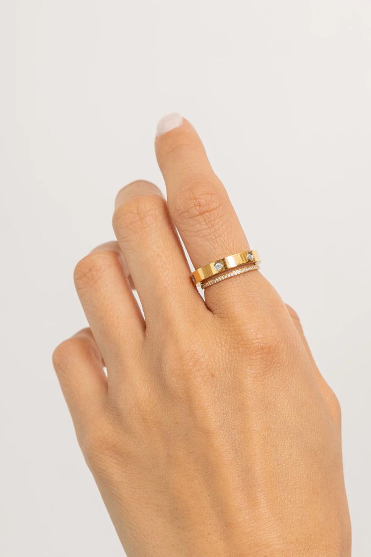 Add some bling to your fingers with our diamond ring band. Subtle yet stunning, it’s perfect for stacking or wearing solo. Made from stainless steel with a robust layer of 18K gold, waterproof and made to live in, featuring stones that look like real diamonds. Waterproof💧💧💧 Stainless Steel and Cubic Zirconia Crystals 18K Gold Hypoallergenic Nickel Free Everyday Stackable Diamond White Diamond Ring, Yellow Gold Stackable Midi Rings With Cubic Zirconia, Stackable Yellow Gold Midi Rings With Cubic Zirconia, Stackable Cubic Zirconia Midi Rings In Yellow Gold, Everyday Vvs Clarity Stackable Rings, Gold Diamond Stackable Crystal Ring, Gold Stackable Diamond Crystal Ring, Stackable Gold Crystal Ring With Diamonds, Everyday Diamond White Rings With Single Cut Diamonds