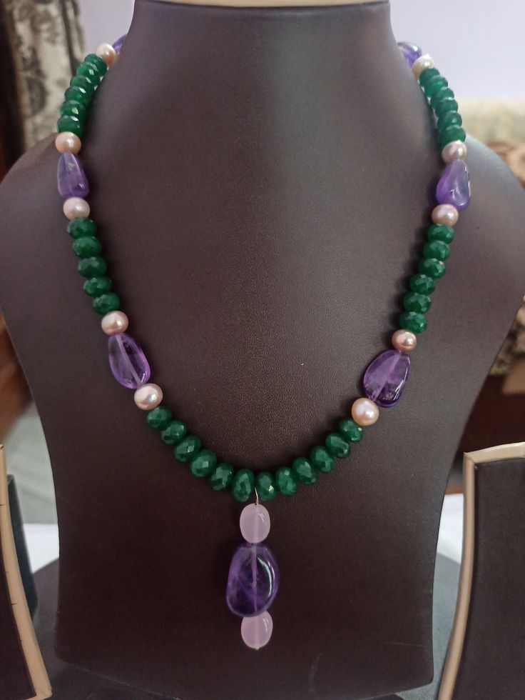 AAA Emerald Beryl Dyed, Fresh Water Pearl Faceted Rondelle 8 mm Beads With Center Tumble Gemstone 20 inch Necklace Stone : Emerald Beryl dyed, Fresh Water Pearl, Amethyst Shape :- Rondelle Size :- 6-8mm 1. Weight :- 246 carat With Amethyst Tumble, 20 INCH Necklace Polish :- Handmade Purity :- AAA color - green, blue It is known as the 'love stone' as the message it emits is the strong vibration of unconditional love, joy, warmth and healing. As quartz crystals are profound amplifiers of energy, Natural Stone Necklaces Handmade, Green Pearl Necklace With Natural Stones, Green Necklaces, Pearl Amethyst, Amethyst Tumbled, 20 Inch Necklace, Carnelian Bracelet, Beaded Necklace Designs, Necklace Stone