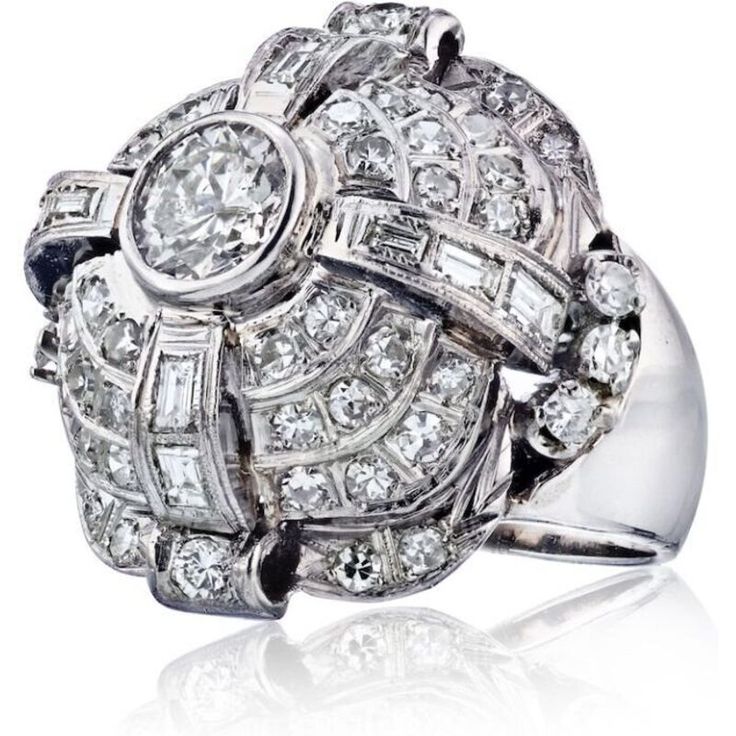 Indulge in the captivating allure of our Platinum Dome Shaped Diamond Ring. This exquisite piece is a testament to the timeless elegance and superior craftsmanship that defines our brand.Imagine slipping this ring onto your finger and feeling the weight of pure luxury. Crafted with meticulous attention to detail, this ring features a stunning dome-shaped design that effortlessly commands attention. The lustrous platinum metal enhances its sophisticated appeal, creating a radiant backdrop for the Emerald Cut Diamond Ring, Platinum Metal, Women Diamond, Antique Diamond, Emerald Cut Diamonds, Ring Size 7, Diamond Gemstone, Estate Jewelry, Diamond Rings