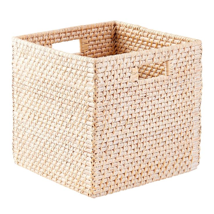 a large woven basket with handles on the bottom and sides, is shown in natural colors