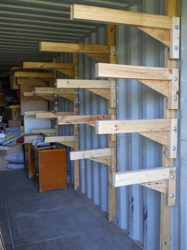 several stacks of wooden pallets stacked on top of each other