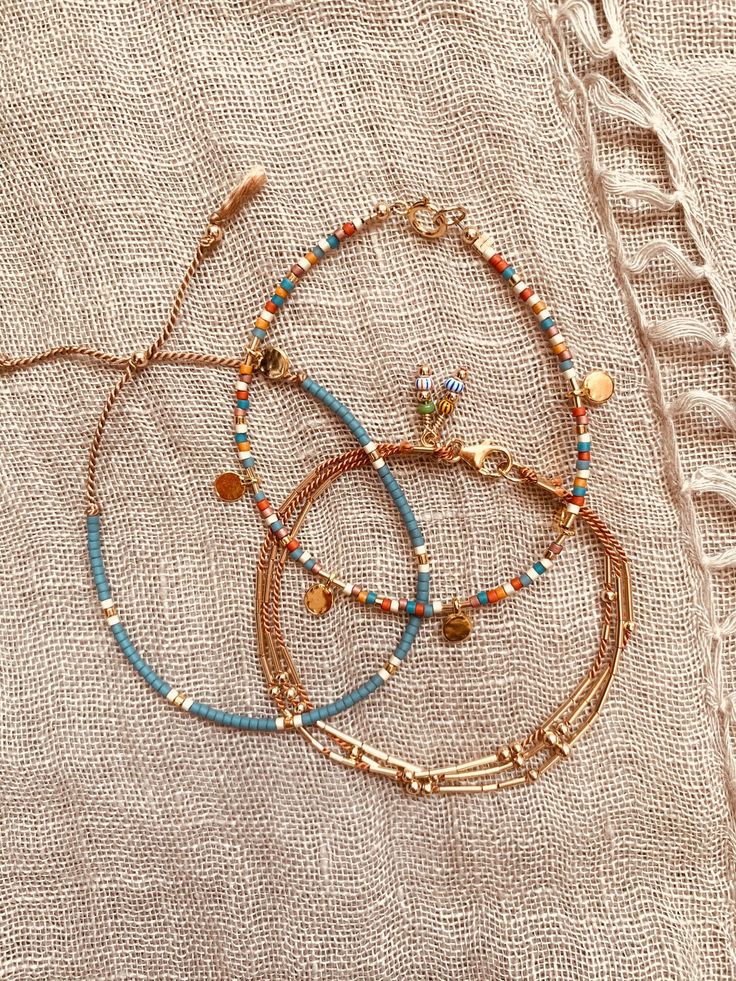 "This is my favorite combo set and the one I wear every day!  :)  This listing is for a SET OF THREE BRACELETS or choose just one in the dropdown menu:  1-\"Multi w/ charms\" - Multicolored Miyuki Beaded Bracelet with 6 Gold Vermeil Round Charms and gold filled bar beads on either side of each charm. 2- \"Bars and Beads\" - Gold Fill round beads and Gold Fill bar beads on 3 strands of camel colored silk cord. 3- \"Green Slider\" - Grayish Green, Cream, and Gold Miyuki Beads on tan silk cord. Gol Everyday Bohemian Heishi Beaded Bracelets, Bohemian Beaded Bracelets With Tiny Beads, Bohemian Friendship Bracelets With Gold Round Beads, Bohemian Friendship Bracelets With Gold Beads, Bohemian Bracelets With Spacer Beads For Everyday, Bohemian Friendship Bracelets With Heishi And Gold Beads, Bohemian Friendship Bracelets With Gold Beads As A Gift, Everyday Bohemian Bracelets With Tiny Beads, Heishi Beaded Chain Bracelet Jewelry