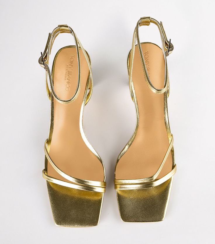 Complete your party look with our Corso strappy heels in gold nappa. Designed with slender foot-framing straps, an adjustable and secure ankle strap, and is finished with a mid-height stiletto heel. -Material: Leather Upper & Lining -Sole: Rubber -Fit: True to size -Toe-shape: Squared toe-shape -Heel: 8.5cm stiletto heel Chic Gold Sandals With Sculpted Heel, Gold Heels With Sculpted Heel And Single Toe Strap, Gold Heels With Heel Loop For Formal Occasions, Gold Sandals With Sculpted Heel For Gala, Gold Sandals With Heel Loop For Cocktail, Chic Gold Sandals With Wrapped Heel, Gold Sandals With Heel Strap For Cocktail, Gold Single Toe Strap Heels For Spring, Gold Heels With Single Toe Strap For Spring