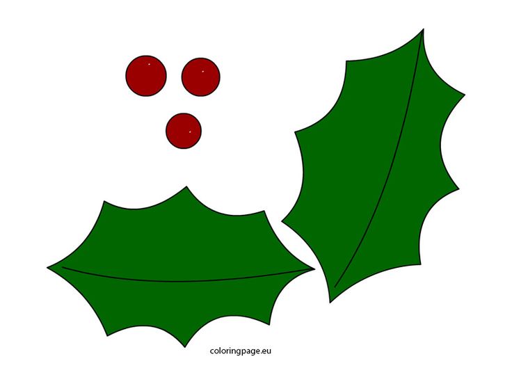 a green holly leaf with two red berries on it's side, cut out from the paper