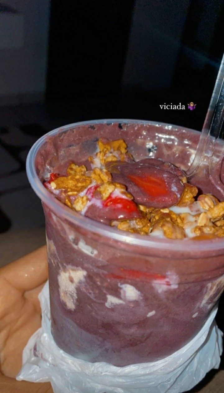 a plastic cup filled with fruit and cereal