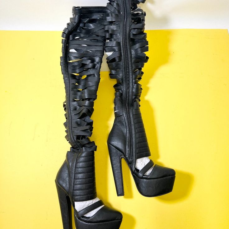 Meet The Jeffrey Campbell Gashed Boot In Black, A Classic Thigh-High Style That Never Goes Out Of Fashion. These Boots, Featuring Gash Cuts All Over, Measure Around 31" From The Top To The Bottom Of The Heel. Pair Them With Your Favorite Black Dress And A Bold Red Lip For A Killer Look. Black. 6" Heel. 2" Platform. 31" From Top To Bottom Heel. Side Zipper Closure. Leather. Runs Tts. Sold As Is. No Returns Or Cancellations - See Pictures. Feel Free To Ask Questions. Bundle For Discount! Edgy Knee-high Party Heels, Edgy Knee-high Heels For Night Out, Edgy Thigh High Platform Boots For Party, Black Platform Knee-high Boots For Evening, Evening Black Platform Knee-high Boots, Edgy Knee-high Boots For Evening, Black Thigh High Platform Boots For Evening, Edgy Black Knee-high Boots For Party, Edgy Black Knee-high Heels