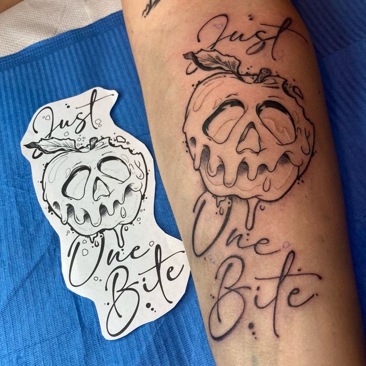 a person with a tattoo on their arm next to a sticker that says just eat the bite