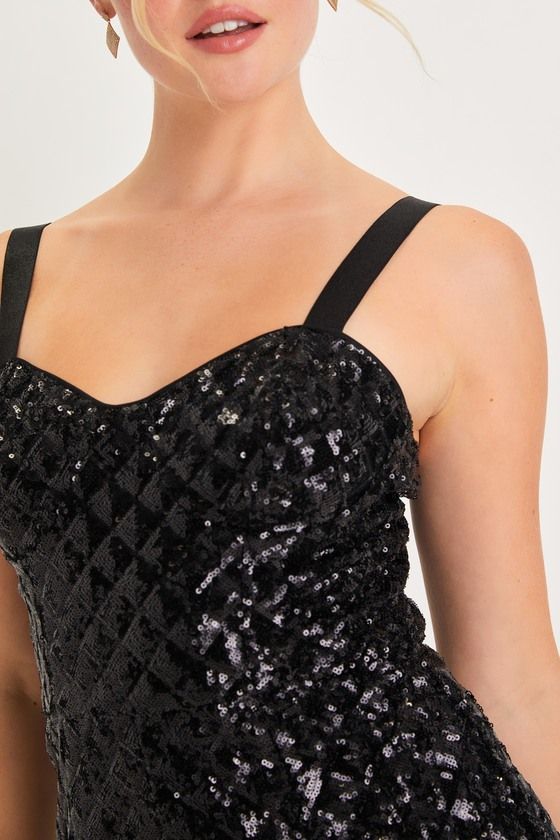 You'll radiate with undeniable glamour when you strut in wearing the Lulus Alluring Glow Black Sequin Sleeveless Bustier Romper! Glittery black sequins create an ultra-subtle diamond pattern across this impressive romper that features a bustier-style bodice with seamed cups and a flirty sweetheart neckline, supported by stretchy elastic tank straps. The fitted waist tops a pair of cute shorts that will perfectly show off your favorite pair of heels! Hidden back zipper/clasp. Fit: This garment fi Black Sleeveless Corset For Party, Glamorous Sleeveless Corset For Parties, Sleeveless Party Corset With Corset Back, Black Party Corset With Spaghetti Straps, Black Spaghetti Straps Corset For Party, Glamorous Sleeveless Evening Corset, Sleeveless Corset For Party Season Night Out, Glamorous Fitted Tank Top For Party Season, Sleeveless Party Corset With Fitted Bodice