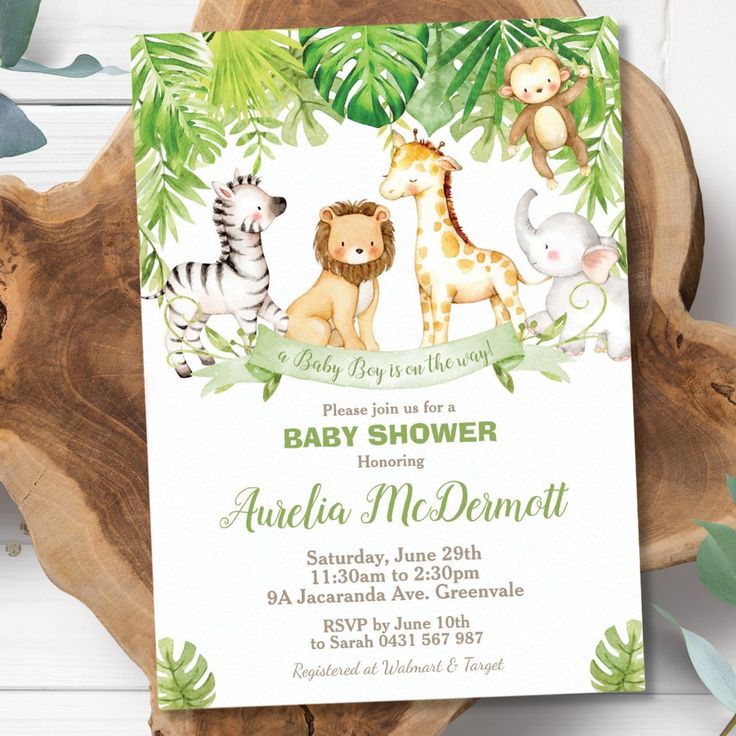 a baby shower with jungle animals and giraffes