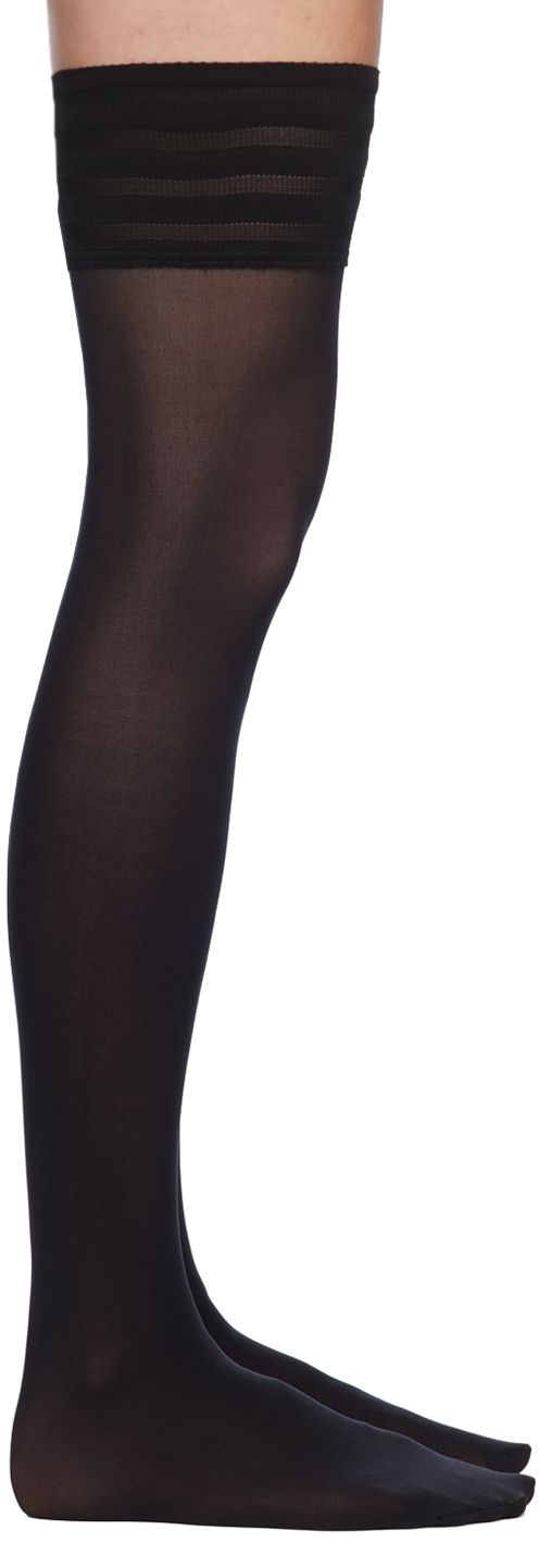 Semi-sheer thigh-high stretch nylon jersey socks in black. · 50 denier · Silicone bands at rib knit elasticized cuffs Supplier color: Black Black Stretch Nylon Knee-high Socks, Elegant Black Nylon Tights, Stretch Thigh High Hosiery, Black Knee-high Nylon Socks, Thigh High Stretch Stockings, Solid Color Stretch Thigh-high Stockings, Fitted Nylon Over-the-knee Hosiery, Stretch Solid Over The Knee Socks, Stretch Solid Color Over-the-knee Socks