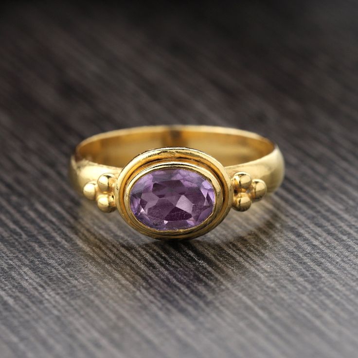 18K Gold PLATED on 925 Sterling Silver. Metal : Solid Sterling Silver with 925 Stamp. Stone - Natural Amethyst  Weight - 3.1 gm. Stone Size - 6x8mm Gold Amethyst Ring With Diamond Accents, Classic Gold Amethyst Birthstone Ring, Gold Amethyst Ring With Hallmark, Gold Amethyst Birthstone Ring Heirloom Style, Gold Amethyst Gemstones With Accent Stones, Gold Heirloom Amethyst Ring, Heirloom Amethyst Ring In Yellow Gold With Bezel Setting, Heirloom Gold Amethyst Birthstone Ring, Gold Amethyst Ring In Sterling Silver