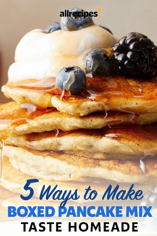 pancakes stacked on top of each other with blueberries and syrup