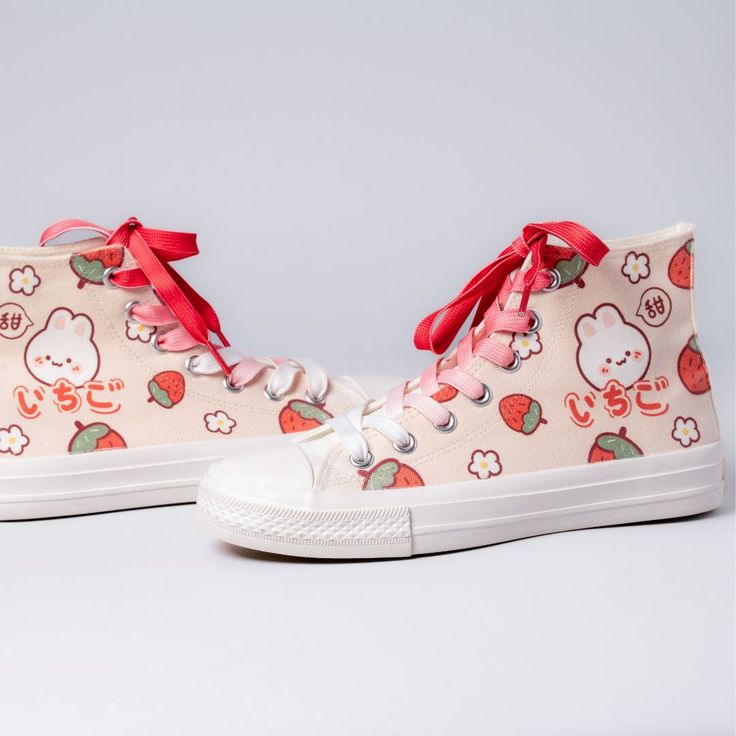 Features: Bring the cute to your outfit in these super adorable Kawaii Strawberry Bunny High-Top Canvas Shoes. These shoes are great for giving your casual wear that extra pop of kawaii personality. They make a great gift for anyone who loves adorable things, and are sure to be a hit! Made with high-quality canvas material to be both durable and comfortable to wear. The outsole material is made with rubber, giving it added protection against outside elements such as dirt and water. **These custo Harajuku Anime Print Sneakers With Round Toe, Harajuku Style Anime Print Round Toe Sneakers, Casual Sneakers With Anime Print And Round Toe, Casual Sneakers With Anime Print, Cute Lace-up Canvas Shoes With White Sole, Cute Cartoon Print Sneakers For Streetwear, Cute White Sneakers With Cartoon Print, Cute Canvas Shoes With Round Toe For Streetwear, Casual Lace-up Sneakers With Anime Print