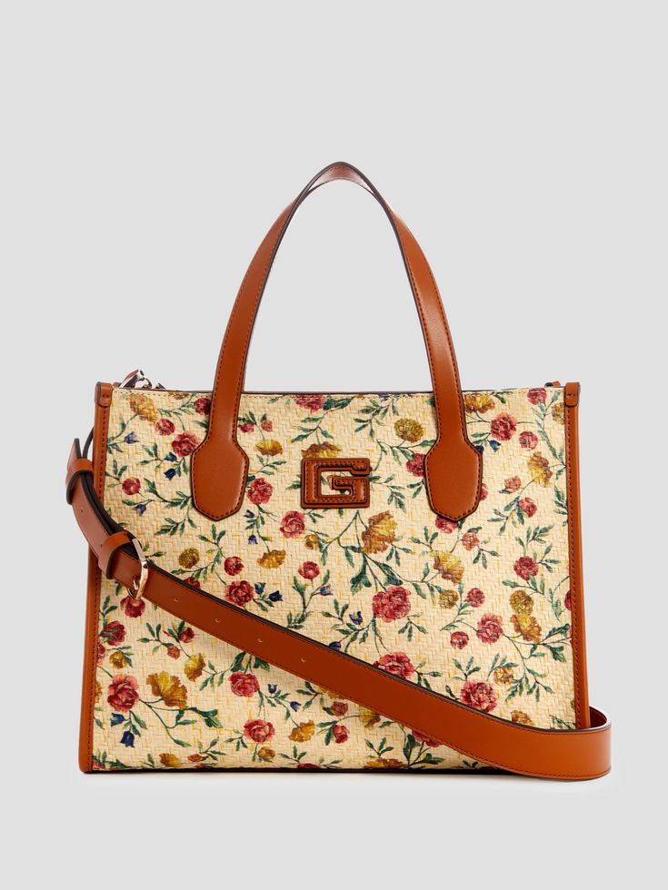 Woven straw tote Floral print Faux-leather trim Shiny gold-tone hardware Signature patch Split-compartment construction Lined interior Top zip closure Top handles with 5.5" drop. Adjustable shoulder strap with 19.75" drop. 13.25"W x 10.25"H x 5"D Colorful Purse, Shopping Addict, Work Purse, Unicorn Bag, Things I Need To Buy, Crossbody Handbags, Straw Tote, Style Aesthetic, Pretty Bags