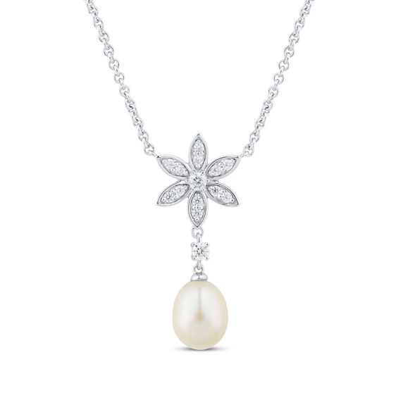 A gift she'll wear again and again, this cultured pearl drop necklace is a refreshing design. Crafted in sterling silver The flower centerpiece is filled and centered with round-cut white lab-created sapphires A single round white lab-created sapphire is a bridge to the luxe 8 x 8.5mm oval freshwater cultured pearl drop below The 18-inch cable chain necklace secures with a lobster clasp Formal Flower Pendant Necklace For Mother's Day, Elegant Pearl Flower Necklace, Elegant Flower Shaped Pearl Pendant Necklace, Elegant Flower Necklace With Pearl Pendant As Gift, Elegant Flower Necklace With Pearl Charm, Elegant Flower-shaped Necklace With Pearl Drop, Elegant Flower-shaped Pearl Drop Necklaces, Elegant Pearl Drop Necklace With Flower Pendant, Pearl Necklace With Flower Pendant And Pearl Charm