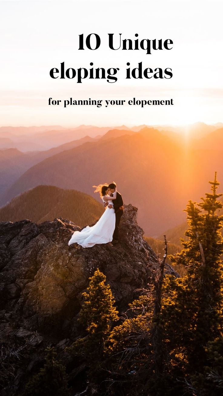 a bride and groom sitting on top of a mountain