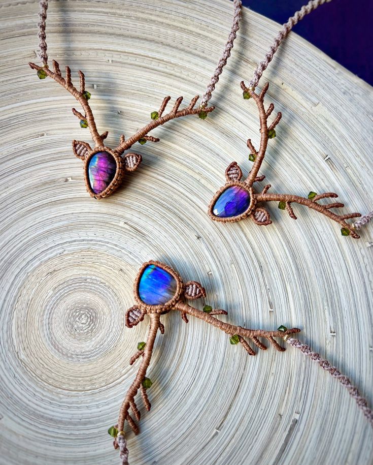 "🦌✨ \"Enchanted Forest Trio\" Macrame Deer Head Necklaces: A Boho Christmas Extravaganza! ✨🎄 As an artist, I've sculpted magic into knots, and behold the result - the \"Enchanted Forest Trio\" Macrame Deer Head Necklaces! Crafted with the mystical gleam of multicolored labradorite and the sparkling elegance of Swarovski beads, these statement necklaces in the shape of deer heads with antlers are your ticket to a Boho Christmas and beyond. Perfect for festivals, weddings, birthdays, and special events, let these woodland wonders add a touch of enchantment to your holiday season and beyond. 🌌❄️ 🌟 The Radiance of Multicolored Labradorite: Labradorite, with its iridescent play of colors, captures the essence of an enchanted forest. Each stone is a magical gem, reflecting the spirit of the Deer Head Necklace, Girl Hunter, Christmas Extravaganza, Deer Heads, Deer Necklace, Hunter Girl, Antler Jewelry, Macrame Wedding, Antler Necklace