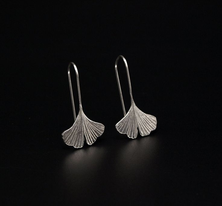 Dainty, small ginkgo leaf earrings made of sterling silver 925. Handmade in-house by Kudaw Pellu. Production: Kudaw Pellu/ Product and object design A. Höpner Material: Sterling Silver 925 silver Size: Earring 2.6cm long, 1.5cm wide Sheet 1.3cm x 1.5cm All jewelry and accessories are handmade with love by Kudaw Pellu. Each one is unique and most pieces of jewelry have their own personal story. We send lots of love and positive energies with each of our creations. If you have any questions or req Ginkgo Earrings, Object Design, Silver Clay, Whimsical Jewelry, Ginkgo Leaf, Aesthetic Style, Leaf Jewelry, Jewelry And Accessories, Gift Handmade