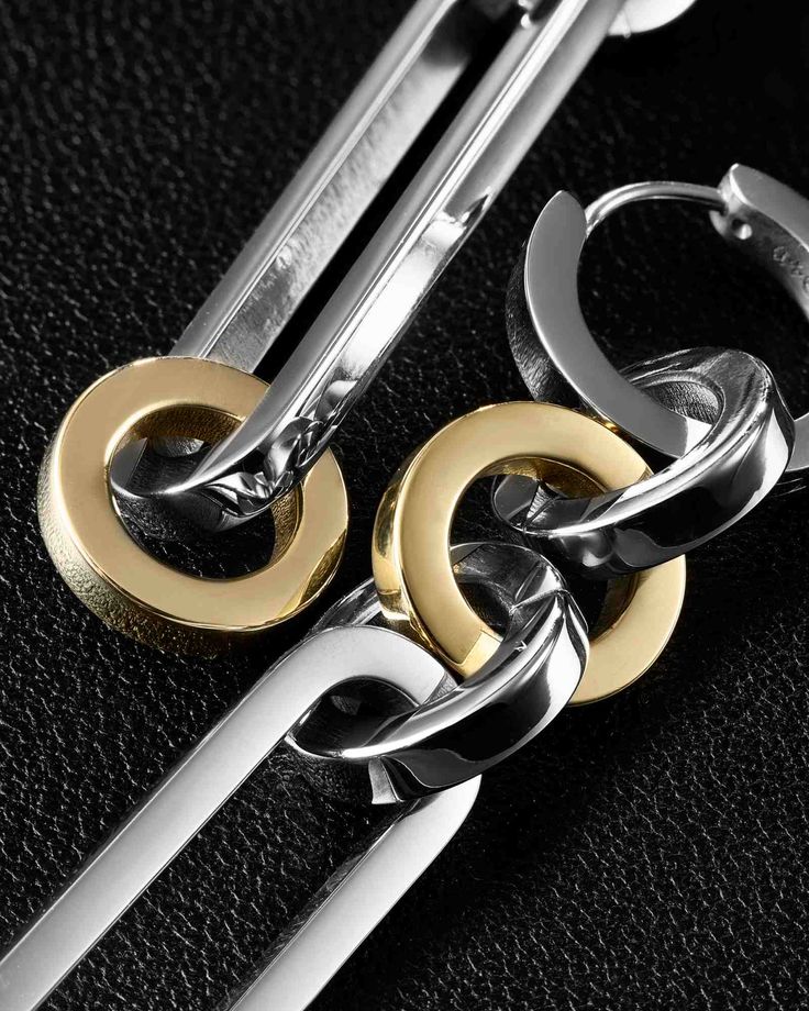 Duality entwined, chaining two truths—earrings that connect contrasting perspectives. A dichotomy of chains in a pair of earrings, embodying contrasting elements. Wear your Paradox Earrings symmetrically, or interchange its detachable piece for an asymmetric look. Made of 316L stainless steel, providing a tarnish-free, hypoallergenic, waterproof, and durable adornment. Complete your look with other jewelry from the Paradox series. Sold as a pair. Each piece is lovingly crafted by hand, under eth Vogue Singapore, Duo Tone, Studs Earrings, April 2024, Online Jewelry Store, Ear Studs, Jewelry Store, Gold And Silver, Two Pieces