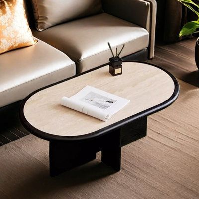 a living room with two couches and a table in front of the coffee table