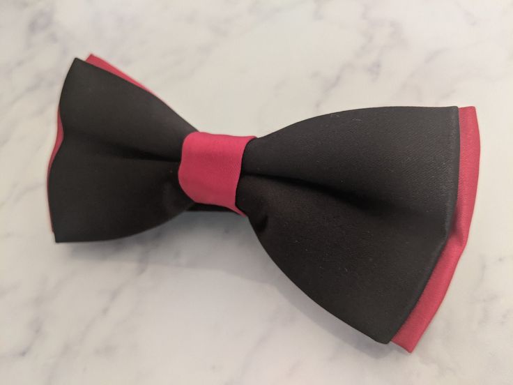 Upgrade your wardrobe in style with this stunning red on black satin bow tie. Perfect gift for him, this unique adjustable bow tie will elevate your style for any occasion including weddings, birthdays and anniversaries. Comes pre-tied. Dapper Red Bow Tie For Party, Red Bow Tie For Party, Formal Bow Tie With Red Bow, Red Bow Standard Bow Tie For Party, Formal Red Bow Tie, Elegant Red Bow Tie Adjustable, Party Red Bow Suit And Tie Accessories, Red Bow Suit And Tie Accessories For Party, Party Bow Tie With Red Bow