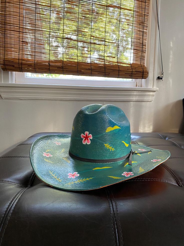 The Femininomenon Hat!  Get it hot like Papa John with this one of a kind handpainted floral cowboy hat!  It is an upcycled Tucson Hat- 6-7/8. Multicolor Fedora With Curved Brim For Rodeo, Bohemian Green Hats For Rodeo, Green Bohemian Hat For Rodeo, Green Bohemian Rodeo Hat, Whimsical Adjustable Hats For Rodeo, Green Western Fedora For Summer, Green Summer Western Fedora, Green Summer Hat For Rodeo, Fun Short Brim Rodeo Hat