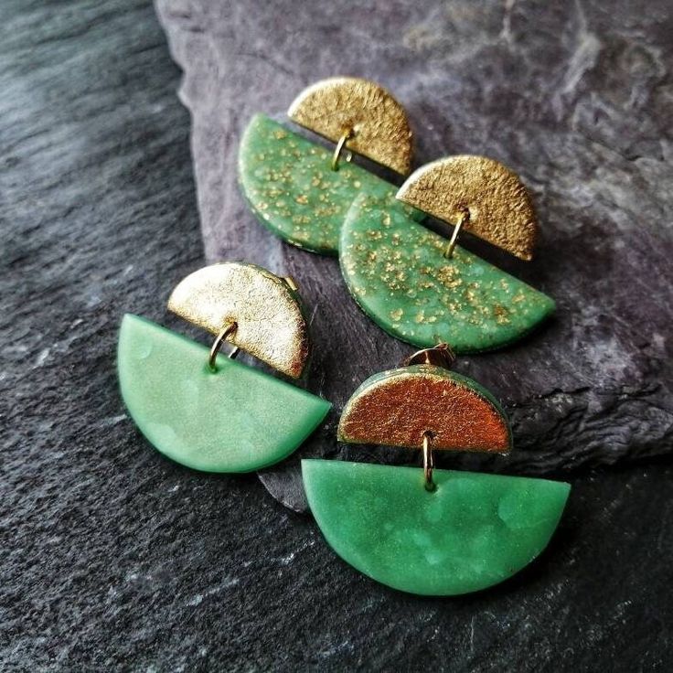 I make these fantastic green and gold clay stud earrings of lightweight Polymer clay, precious 24k gold-leaf and 22ct gold plated brass stud earrings with butterfly clasps. I have chosen the green and gold colour combination to create a modern and stylish Statement piece that is perfect for any occasion. The smaller top half circle is gilded, not only because it gives every earring a high-quality appearance, but it works as a mirror for the sun while you are wearing it.  During the baking proces Green Gold Plated Round Earrings, Green Gold-plated Round Earrings, Green Round Gold-plated Earrings, Unique Gold Earrings With Variations, Gold Drop Earrings With Unique Variations, Gold Polymer Clay Dangle Jewelry, Nickel Free Gold Polymer Clay Jewelry, Handmade Gold Polymer Clay Jewelry, Nickel-free Gold Polymer Clay Jewelry