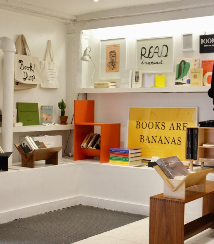 the books are bananas sign is on display in front of some shelves with various books